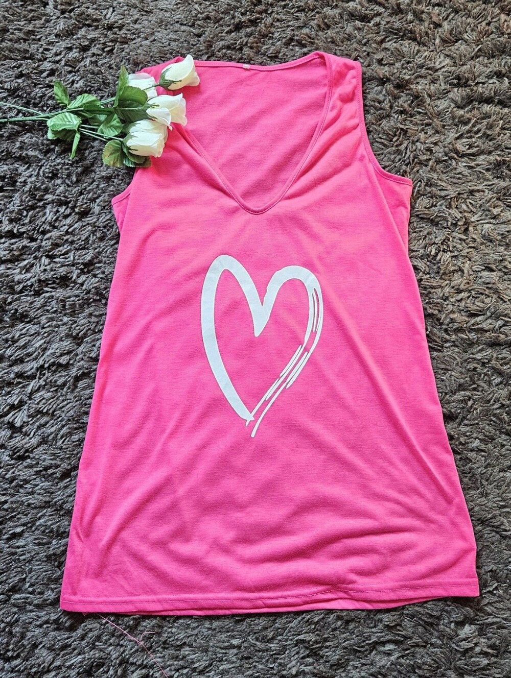 Bright pink tank top size large with white graphic heart print centered on t